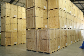 Wooden crates organized within a climate-controlled storage unit in Dallas, TX.