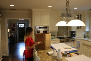 A woman packing boxes in the kitchen, having hassle-free access to move boxes in Fort Worth, TX