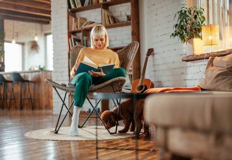 A woman reading a book symbolizing a smooth transition with professional moving services in Fort Worth, TX